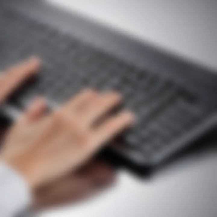 User interacting with a thin wireless keyboard, demonstrating ease of use.